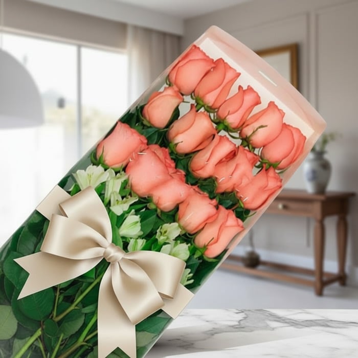Caja de 18 rosas rosadas frescas y vibrantes con un elegante moño beige, presentadas en un fondo sofisticado y bien iluminado